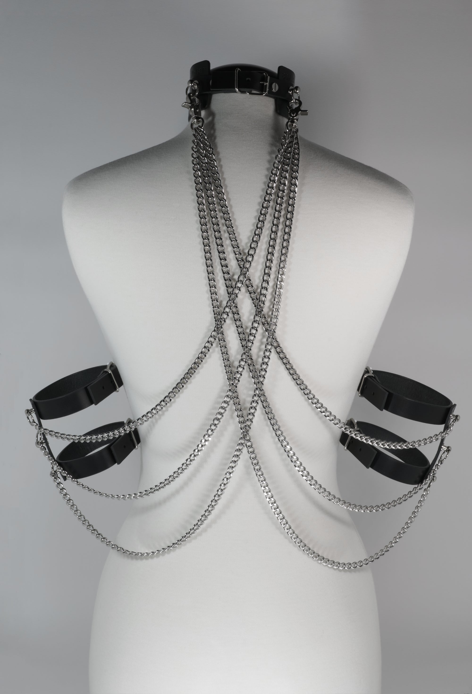 black leather choker with arm cuffs and chains in the back #color_black